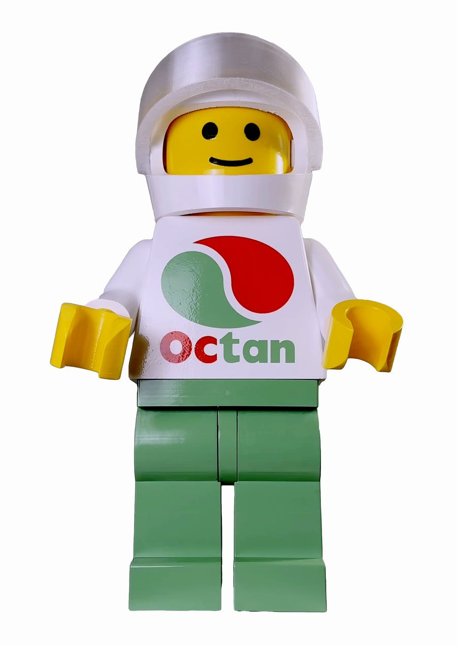 The same figure wearing the white open-face racing helmet, turned through a full revolution — part of the +$49 Accessories add-on