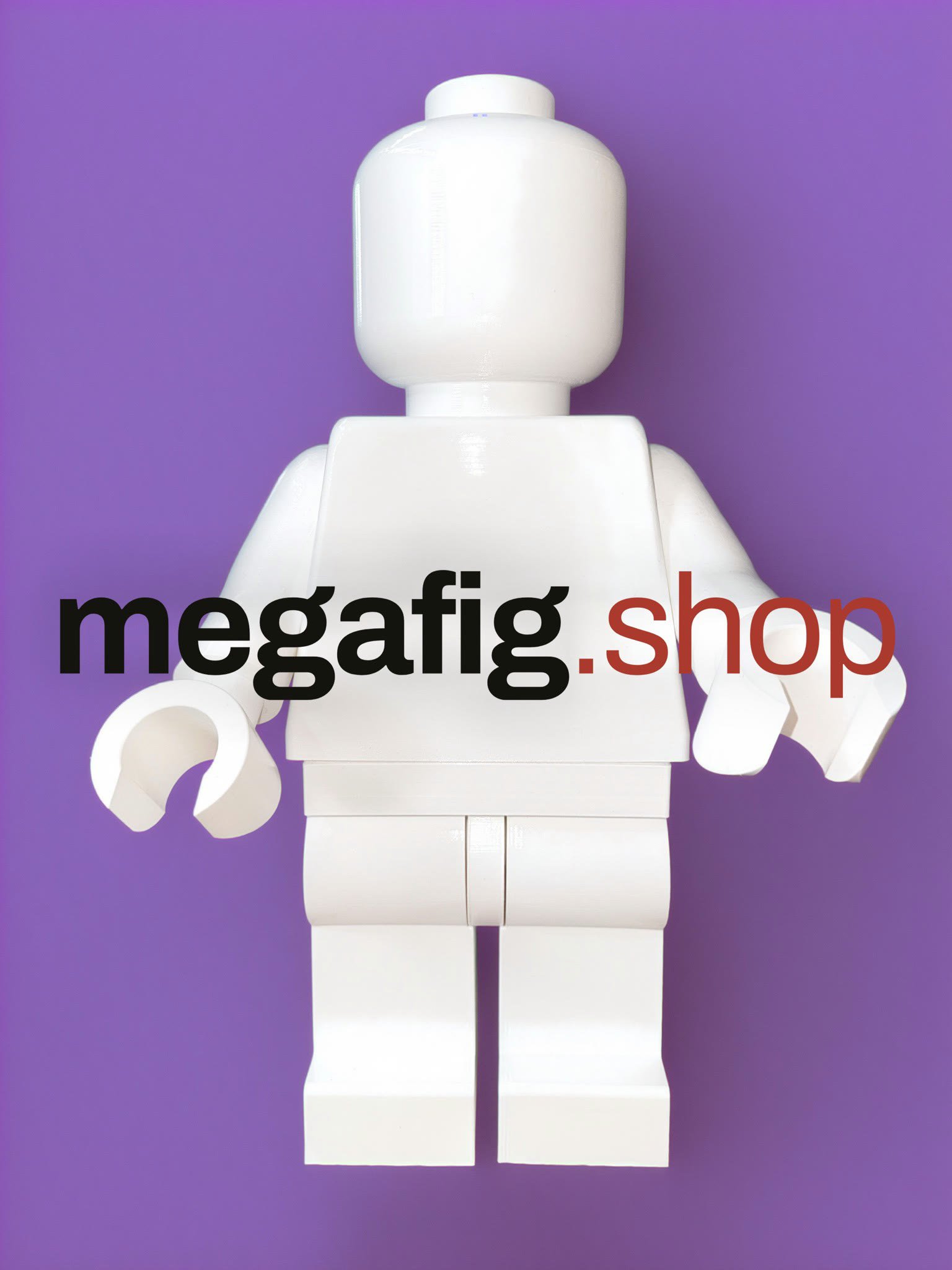 The All White Edition Mega Figure, every part in white, standing against a purple backdrop behind the megafig.shop wordmark